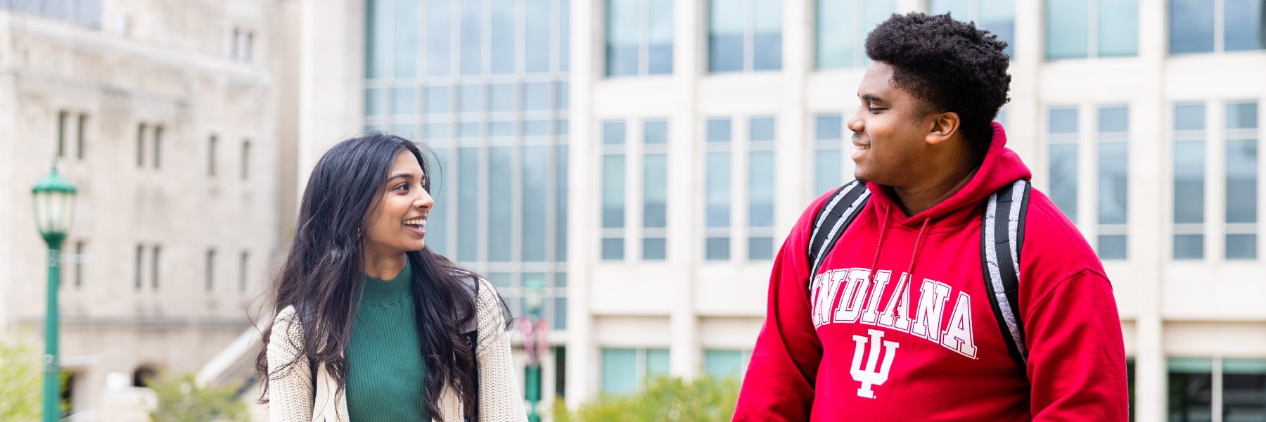 Two students walk and chat